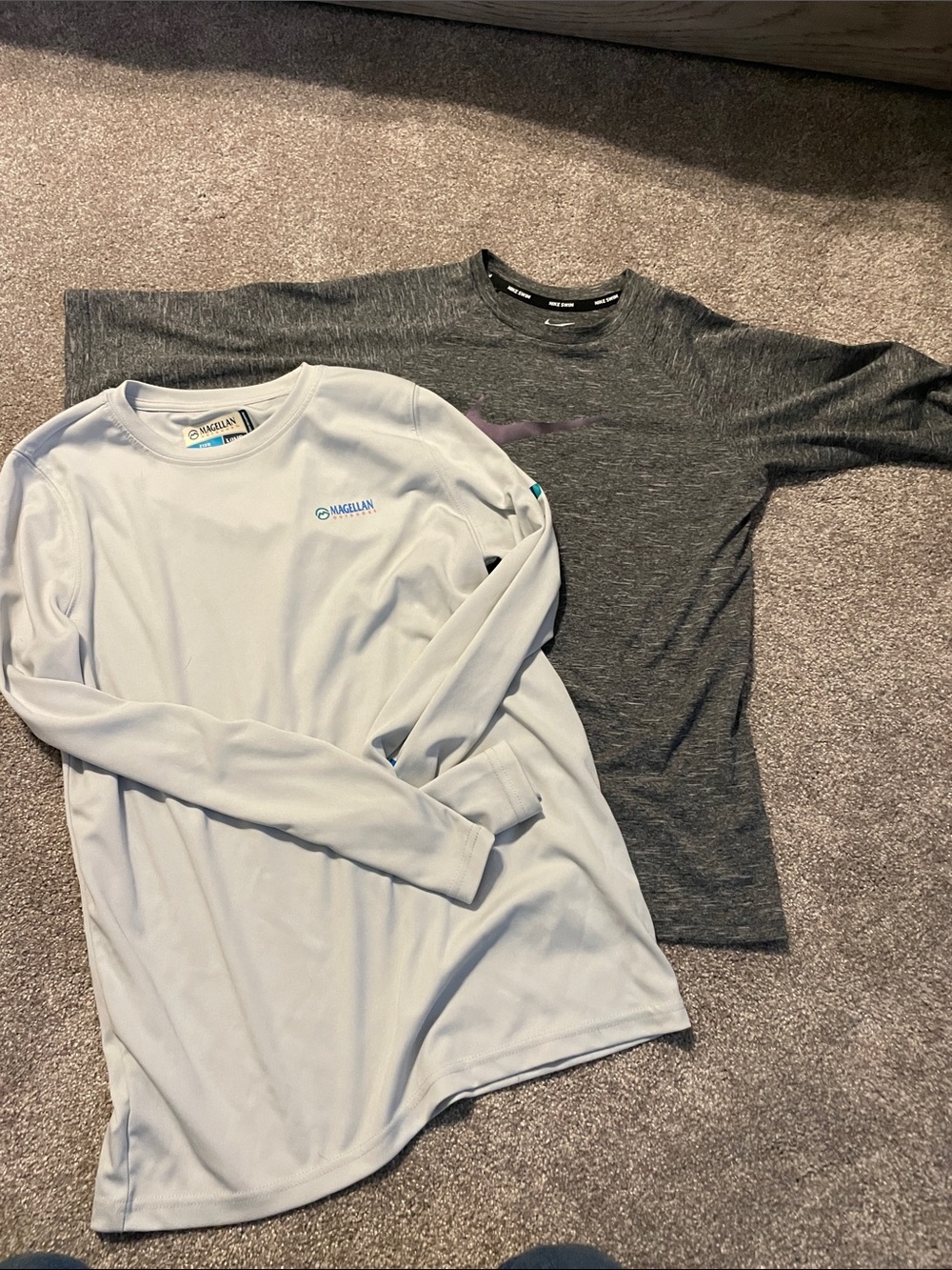 Nike Swim shirt and a Magellan UPF long sleeve